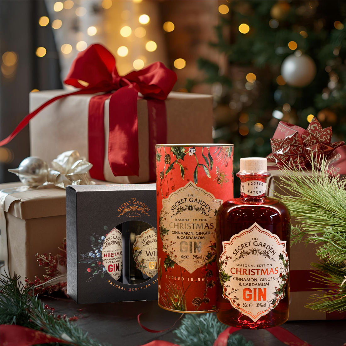 Bottle of Secret Garden Christmas Gin with gin gift boxes and festive decorations in the background