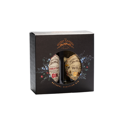 Two luxury gins in a gift box from the Secret Garden showcasing Xmas Gin and organic Wild perfect for experimenting with gin cocktails this festive season 