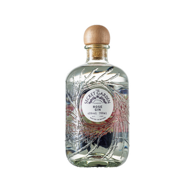 Secret Garden Rose Gin in the embossed recycled glass bottle with bespoke artwork labels representing key botanicals in their luxury premium gins