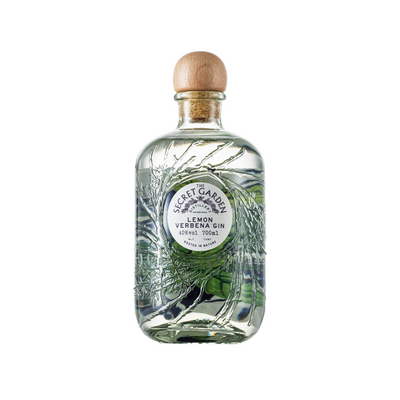 Secret Garden Distillery Lemon Verbena Gin in the embossed recycled glass bottle with bespoke artwork labels representing key botanicals in their luxury premium gins