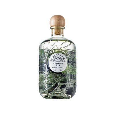 Secret Garden Distillery London Dry Summer Seasonal Gin in the embossed recycled glass bottle with bespoke artwork labels representing key botanicals in their seasonal luxury premium gins